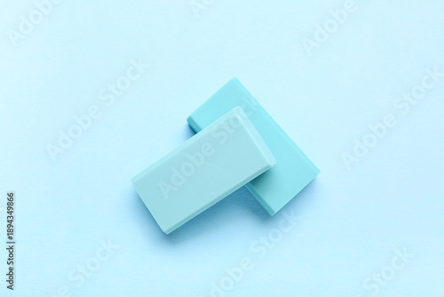 Blue rubber erasers on colo...