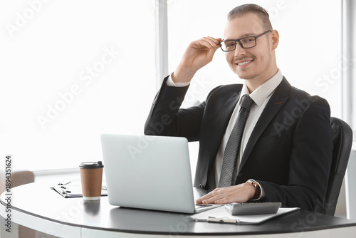 Handsome businessman with e...