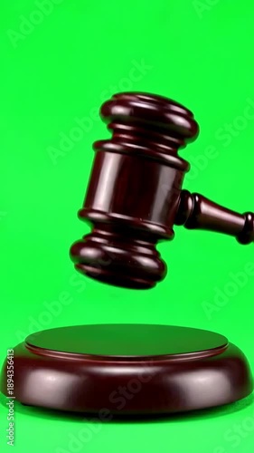 Wallpaper Mural Wooden judge gavel with sound block on green screen background, symbolizing legal justice and courtroom authority. Vertical video Torontodigital.ca