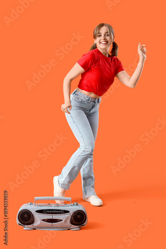 Young woman with boombox da...