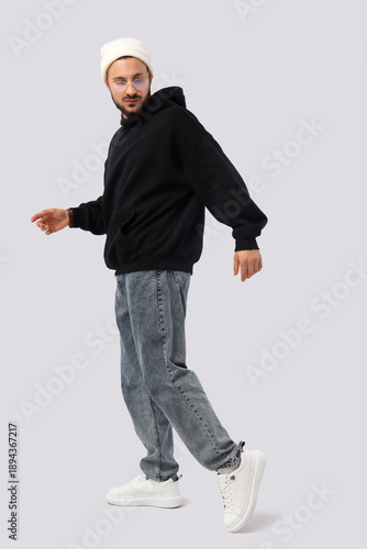 Young man in black hoodie w...