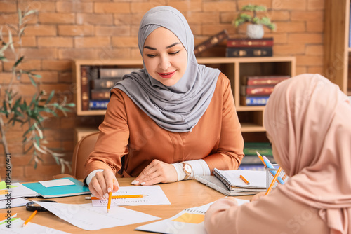 Muslim mother with her litt...