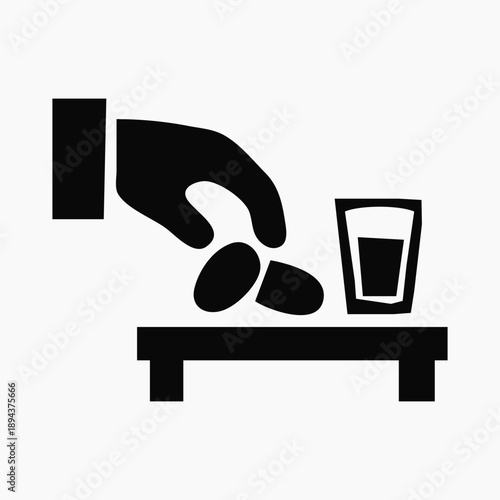 Hand taking pills from a table next to a glass of water, medical icon