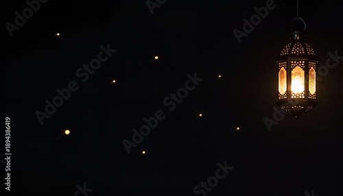 Glowing Golden Ramadan Lantern with Sparkling Light on Black Background,Ramadan Kareem promotions, Eid Mubarak designs, Islamic wallpapers, religious posters, social media graphics, and luxury festive