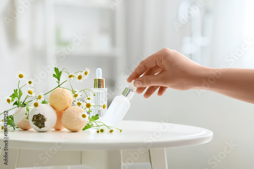Woman hand holding cosmetic...