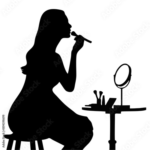Black silhouette of a woman applying makeup at a dressing table