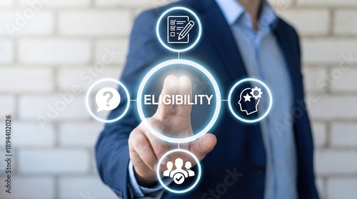Businessman interacting with eligibility icons in modern workspace