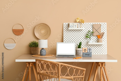 Stylish workplace with mode...
