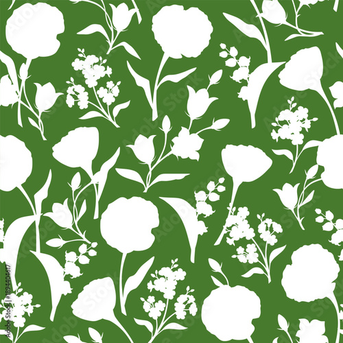 Seamless floral pattern with white flowers silhouettes on a green background. Vector floral print