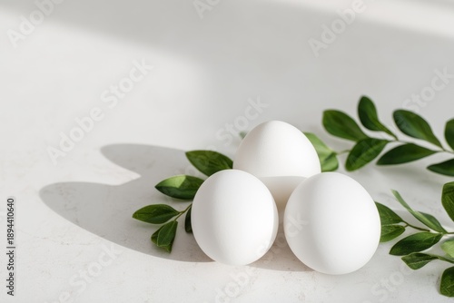 Soft Transformative Easter Eggs Surrounded by Greenery in Minimalist Setting
