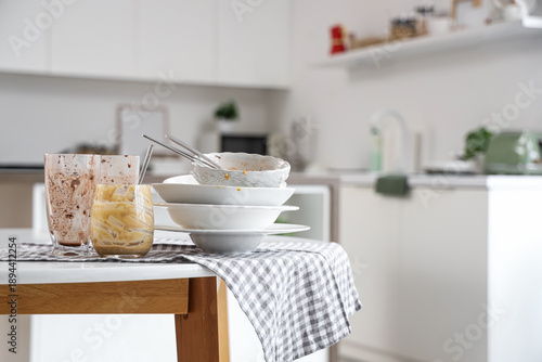 Dirty dishes and glasses on...