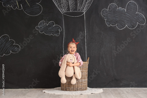 Cute little girl with toy i...