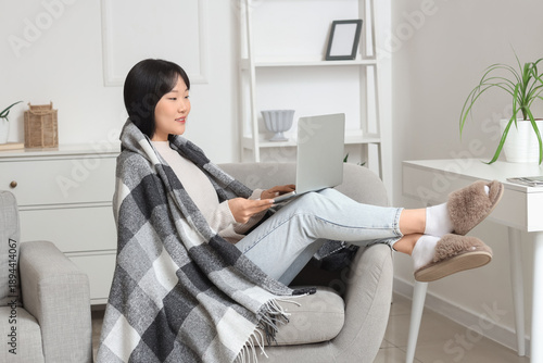 Young Asian woman with plai...