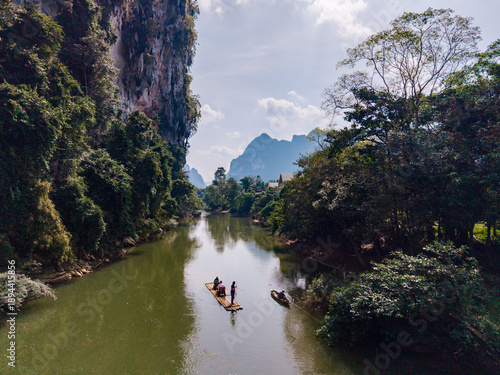 Obraz na płótnie Discover the tranquil beauty of Khao Sok's rivers while canoeing through lush gr