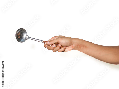 hand holding a stainless steel soup ladle or soup spoon with wooden handle isolated on white background.