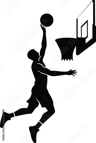 Silhouette of a basketball player jumping towards the hoop to make a shot