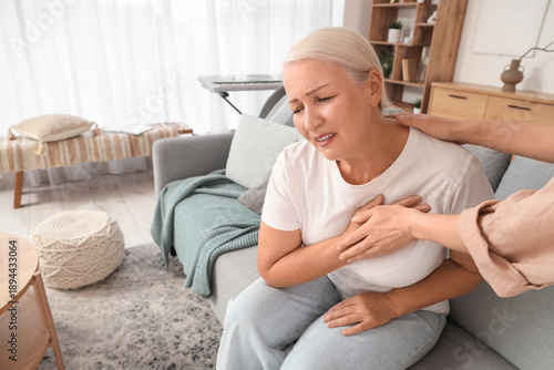 Mature woman having heart a...