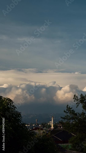 Wallpaper Mural Vertical video - Timelapse of thick wall of clouds rolling above Bandung city skyline Torontodigital.ca