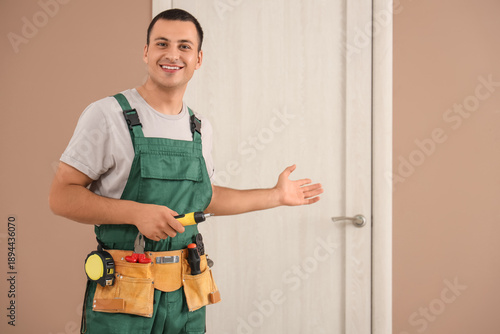 Male worker with tools show...
