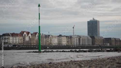 Calm Rhine River with Düsseldorf city skyline in the background