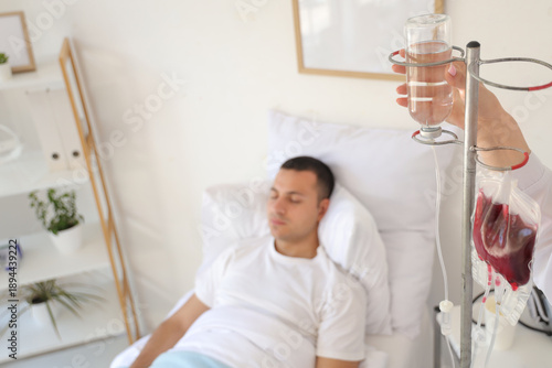 Female doctor giving drip i...
