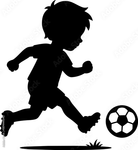 Young boy runs energetically towards soccer ball, showcasing enthusiasm and joy in play