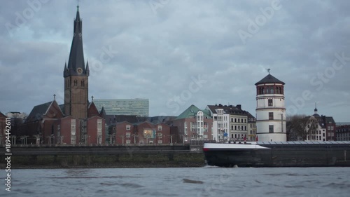 Barge passing Old Town Düsseldorf along the Rhine River