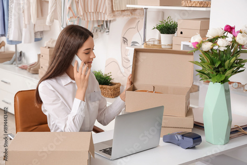Female seller with shoe box...