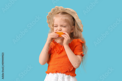 Adorable little girl biting...