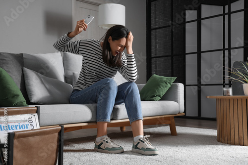 Depressed young woman with ...