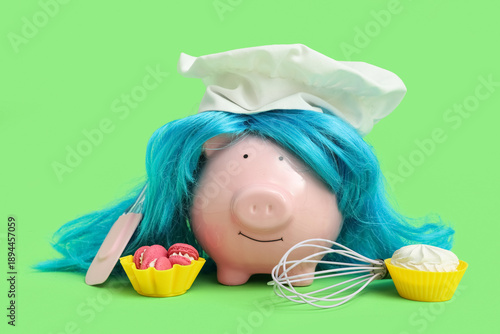 Piggy bank in wig and chef'...