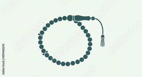 Green prayer beads with tassel on light background