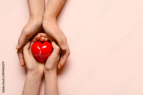 Hands of woman and child ho...