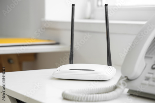 Modern wi-fi router on shel...