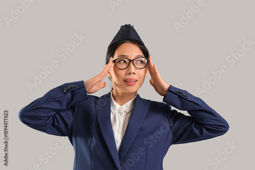 Young Asian stewardess wear...