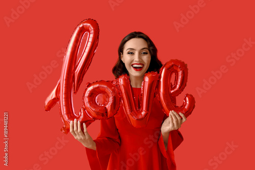 Young woman with air balloo...