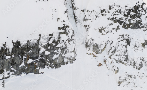 Fotografie Snowy Mountain Cliffs and Snow Field in Rugged Terrain, BC, Canada Landscape Alp