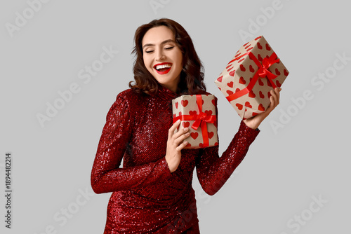 Happy young woman with gift...