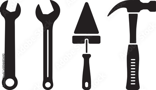Black silhouette of two wrenches a trowel and a hammer on a white background spanner