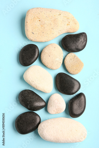 Many pebble stones on blue ...