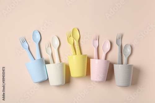 Different cups with cutlery...