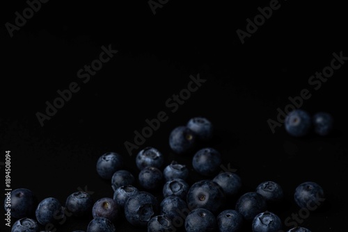 Fresh ripe blueberries on a black background, close up