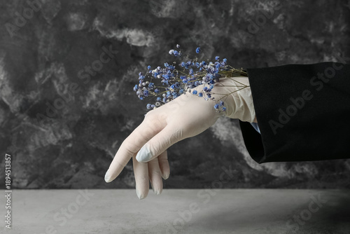 Woman in rubber glove with ...