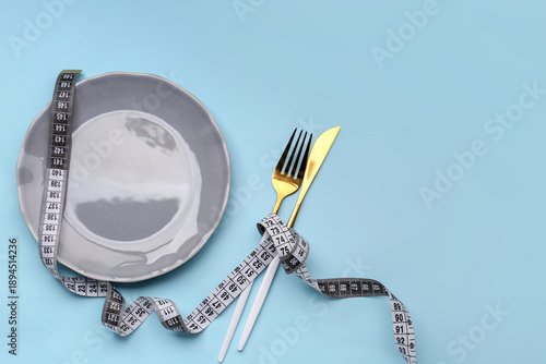 Grey measuring tape, plate ...