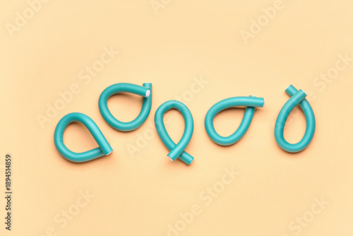 Hair curlers on yellow back...