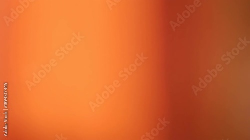 Abstract warm orange light leak overlay featuring soft sun bokeh, bright lens flare, and blurred glare for cinematic video transitions and sunny summer backgrounds