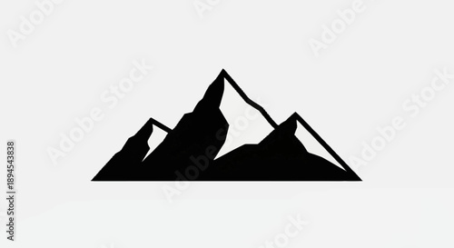 Black silhouette of jagged mountain peaks against a white background.
