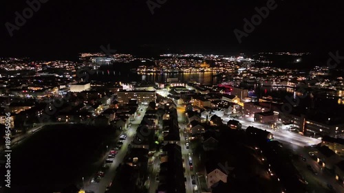 Wallpaper Mural Aerial nighttime view of the port city of Kristiansund on the northwest coast of Norway, brightly lit by street lamps. Torontodigital.ca