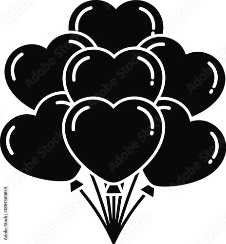 Cluster of black heart shaped balloons floating in air