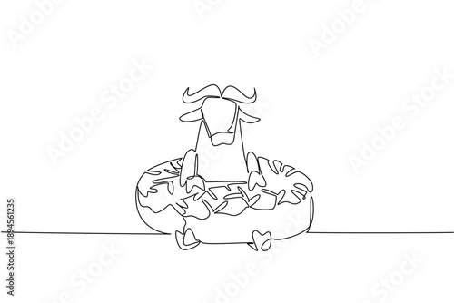 Continuous line drawing of strong buffalo shows cute animal lying inside sweet donut for pastry food concept. Unique design of savanna mammal for kids wall decor purpose in a minimalist style art